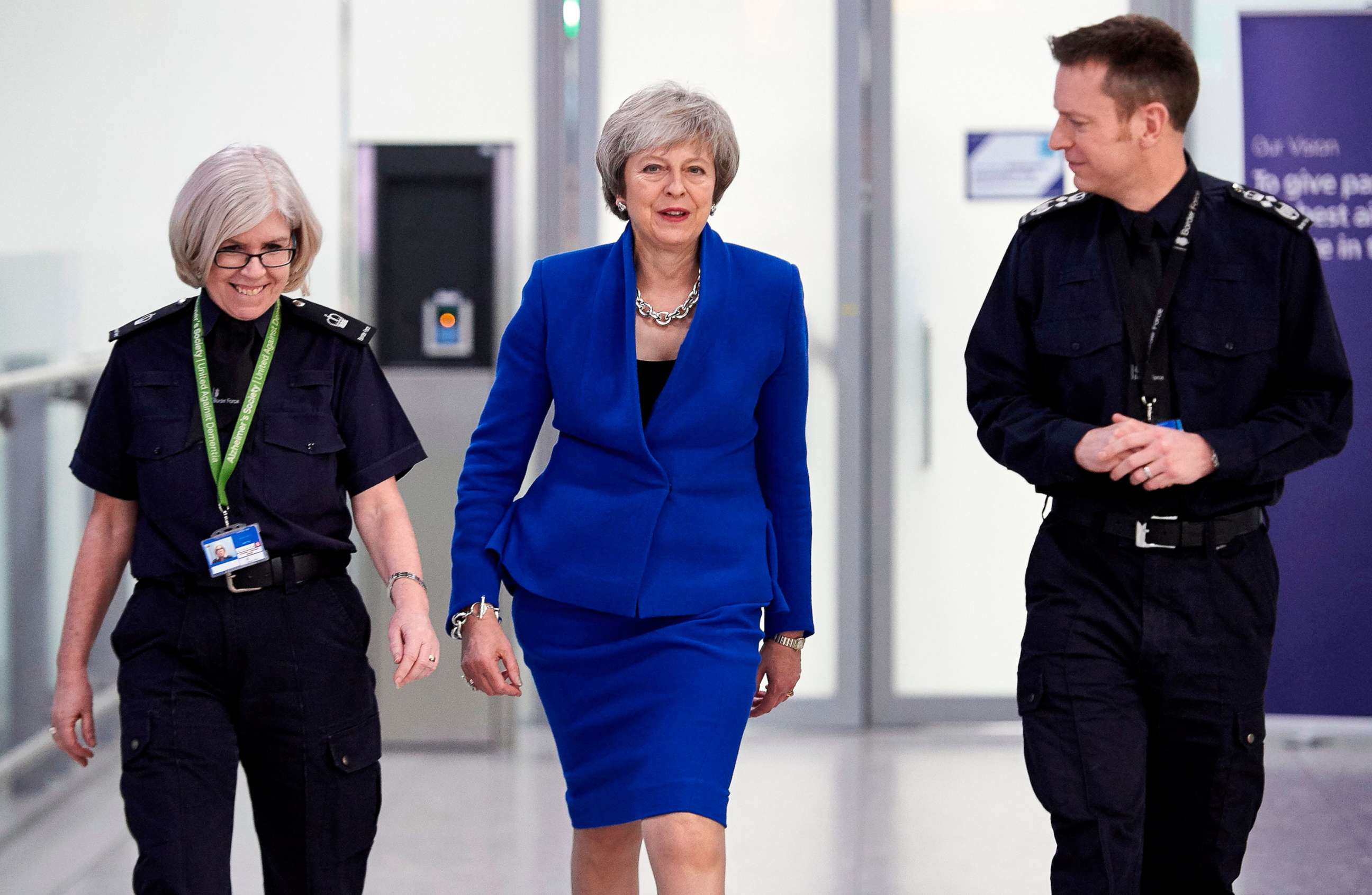 PHOTO: Britain's Prime Minister Theresa May talks with UK Border Force officers as she visits their Command Centre during her visit to Terminal 5 at London Heathrow Airport in west London on Dec. 19, 2018.