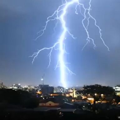 Lightning flashes in Newcastle, New South Wales, as severe weather hits parts of Australia.