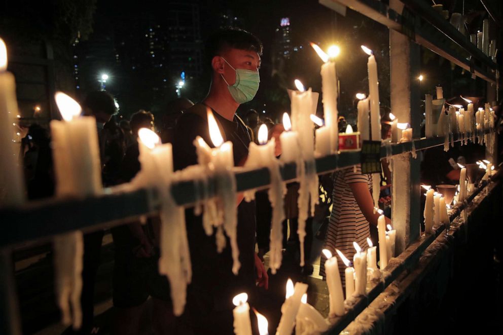 PHOTO: People light candles during a vigil for those killed during the 1989 Tiananmen Square protests at Victoria Park in Causeway Bay, Hong Kong, on June 4, 2020, despite applications for it being officially denied.