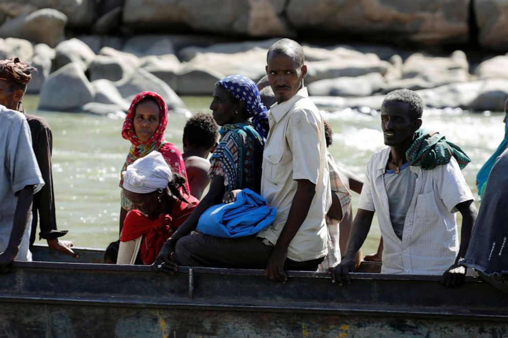 PHOTO: Ethiopians fleeing from the Tigray region arrive by boat to Sudan after crossing a river between the two countries, near the Hamdeyat refugees transit camp, Dec. 1, 2020. 
