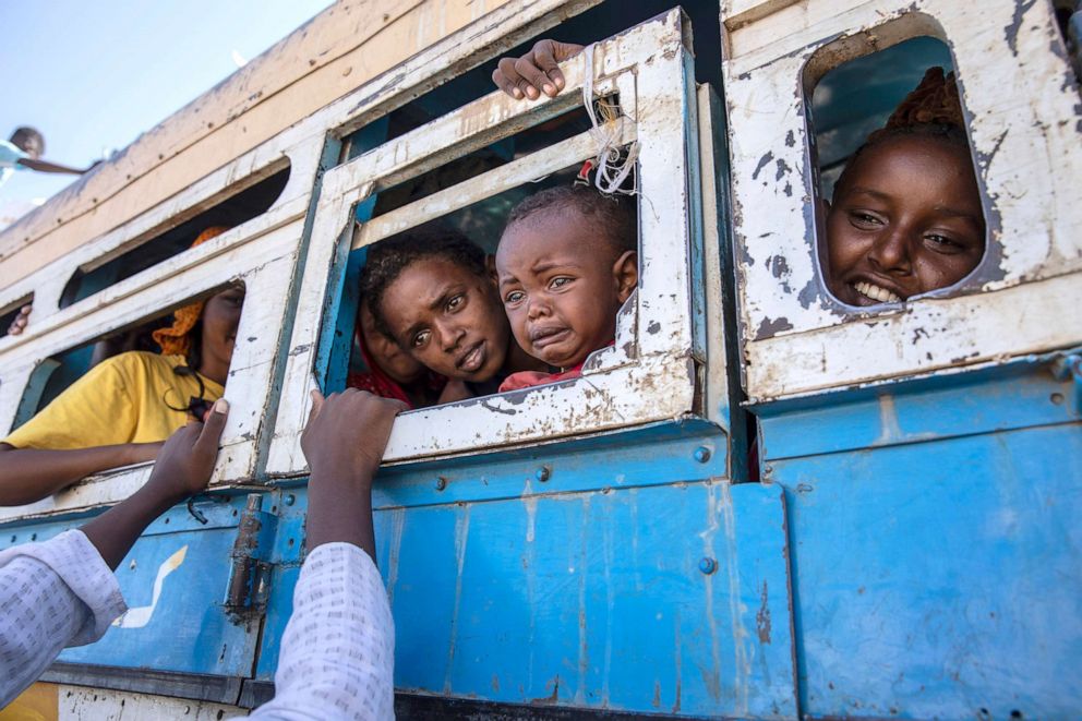 PHOTO: Tigray refugees who fled the conflict in the Ethiopia's Tigray region ride a bus going to a temporary shelter near the Sudan-Ethiopia border, in Hamdayet, eastern Sudan, Dec. 1, 2020.