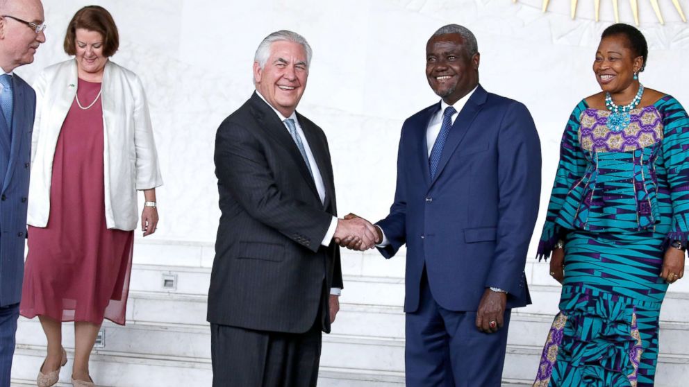 African Union (AU) Commission Chairman Moussa Faki, of Chad, and Secretary of State Rex Tillerson shake hands for photographers after their meeting at AU headquarters in Addis Ababa, Ethiopia, March 8, 2018.
