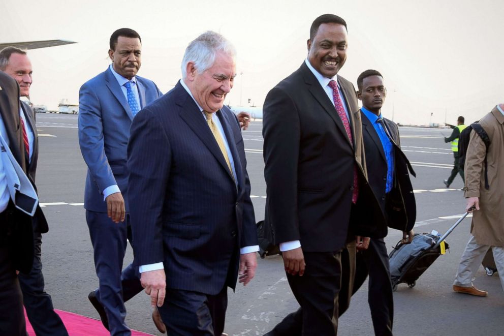 PHOTO: Secretary of State Rex Tillerson (L) smiles as he walks with Ethiopian Foreign Minister Workneh Gebeyehu (R) upon his arrival at the Bole International Airport in Addis Ababa, Ethiopia, March 7, 2018.