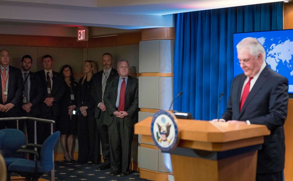 PHOTO: Staff members including Deputy Secretary of State John Sullivan, second from right, watches as Secretary of State Rex Tillerson speaks at a news conference at the State Department in Washington, March 13, 2018.