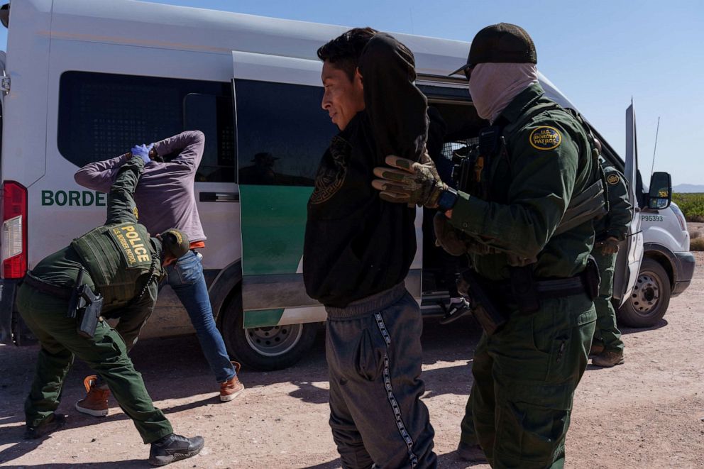 PHOTO: Several men, who were part of a group of migrants who were trying to enter the United States undetected, are searched by United States Border Patrol agents, in Santa Teresa, New Mexico, April 26, 2023.