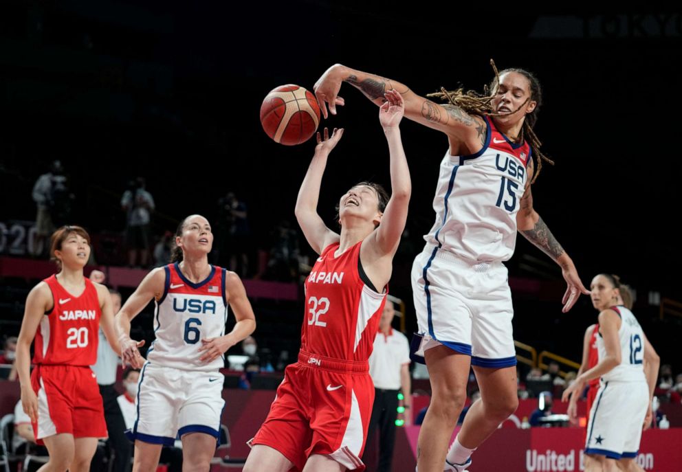 PHOTO: Japan's Saori Miyazaki is blocked by United States' Brittney Griner during the women's basketball preliminary round game at the 2020 Summer Olympics, July 30, 2021, in Saitama, Japan.