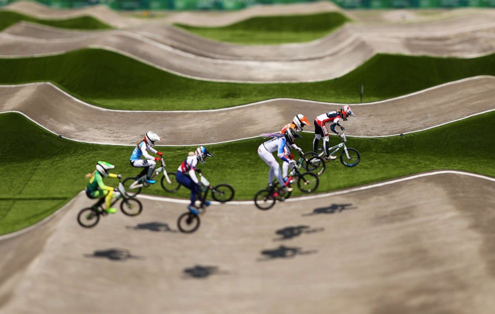 PHOTO: Cyclists go over a jump at the Women's BMX quarterfinal on day six of the Tokyo 2020 Olympic Games at Ariake Urban Sports Park on July 29, 2021 in Tokyo, Japan.