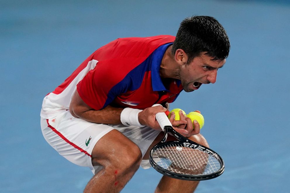 PHOTO: Novak Djokovic, of Serbia, reacts during a semifinal men's tennis match against Alexander Zverev, of Germany, at the 2020 Summer Olympics, Friday, July 30, 2021, in Tokyo, Japan.