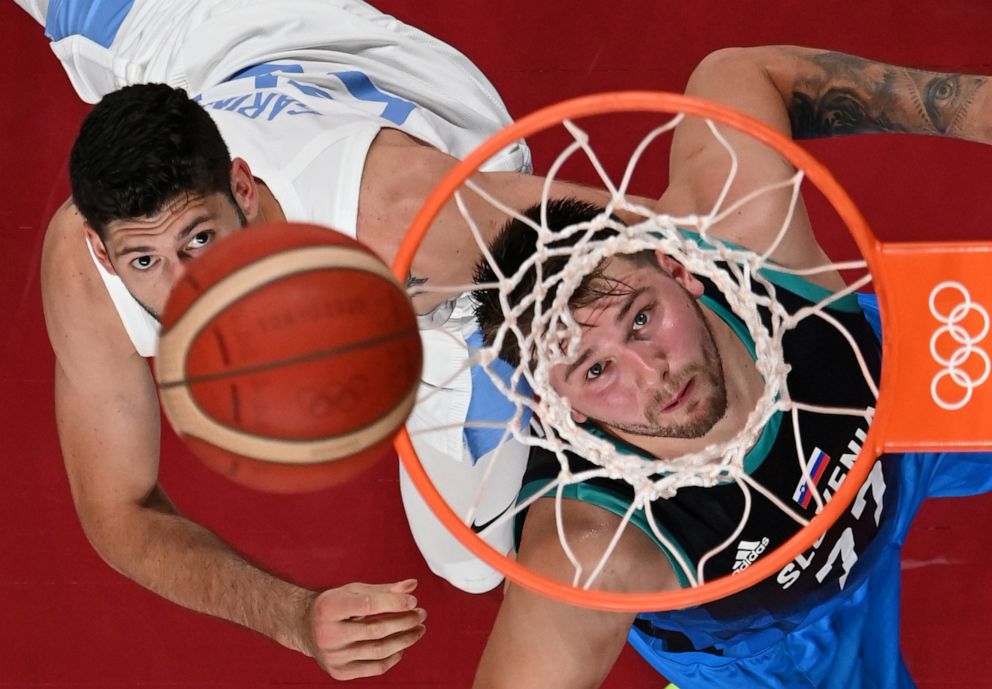 PHOTO: Luka Doncic of Slovenia positions for a rebound against Patricio Garino of Argentina in the group round of men's basketball on July, 26, 2021.