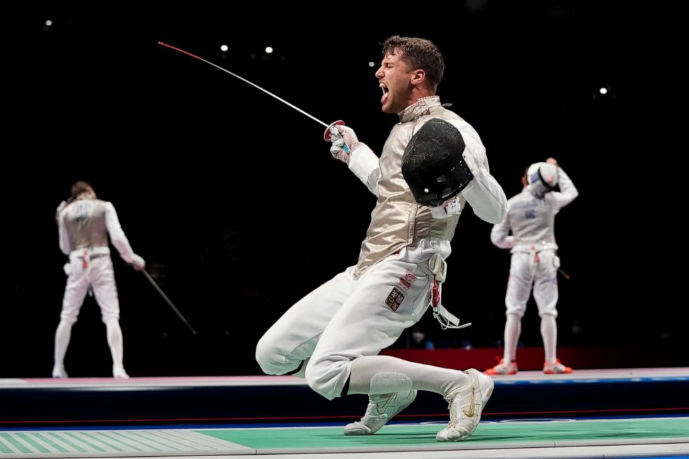 PHOTO: Alexander Choupenitch of the Czech Republic celebrates defeating Peter Joppich of Germany in the men's individual round of 16 Foil competition at the 2020 Summer Olympics, Monday, July 26, 2021, in Chiba, Japan.