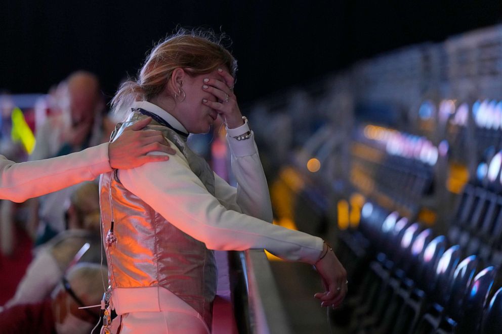 PHOTO: Flora Pasztor, of Hungary, cries after her team lost against Canada Foil team in the women's individual Foil classifications 5-8 competition at the 2020 Summer Olympics, Thursday, July 29, 2021, in Chiba, Japan.