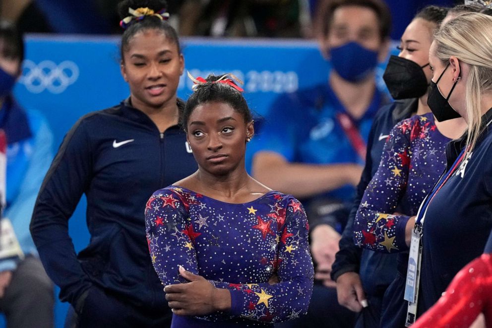 PHOTO: Simone Biles, of the United States, waits for her score after performing on the balance beam during the women's artistic gymnastic qualifications at the 2020 Summer Olympics, Sunday, July 25, 2021, in Tokyo.