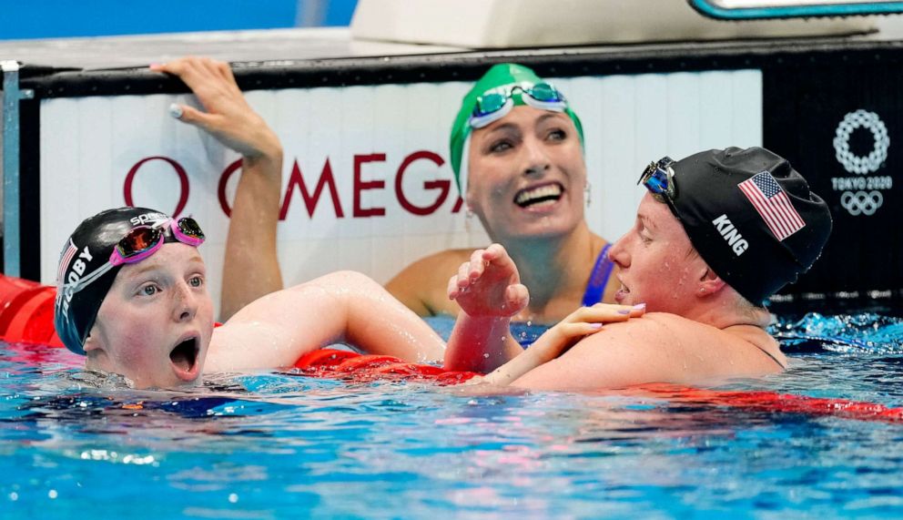 PHOTO: Lydia Jacoby of the United States reacts near Tatjana Schoenmaker of South Africa and Lilly King of the United States after winning the gold medal in the 100m breaststroke on July 27, 2021, in Tokyo.
