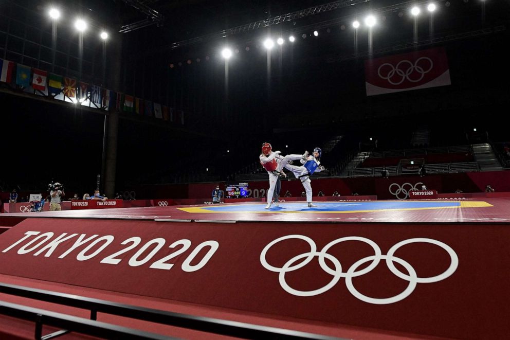 PHOTO: Turkey's Rukiye Yildirim (Blue) and Israel's Abishag Semberg (Red) compete in the taekwondo women's -49kg bronze medal A bout during the Tokyo 2020 Olympic Games at the Makuhari Messe Hall in Tokyo on July 24, 2021.