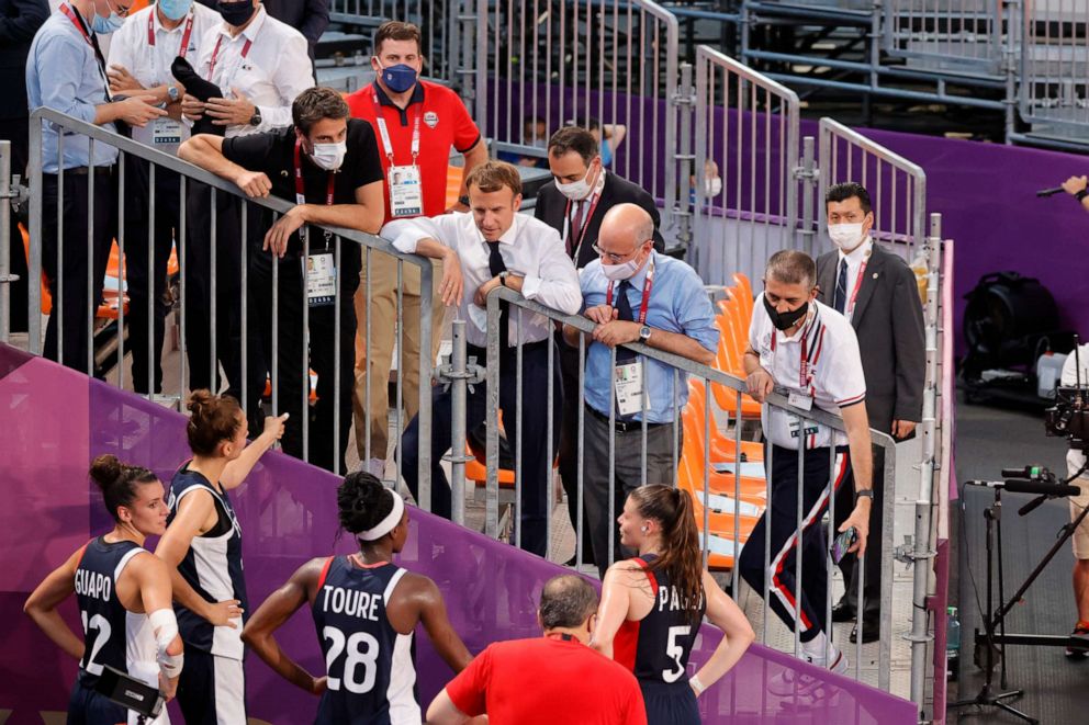 PHOTO: French President Emmanuel Macron and USA first lady Jill Biden attends a France-USA match in the preliminary rounds of the new Basket-Ball 3X3 event of the 2020 Tokyo Olympics.