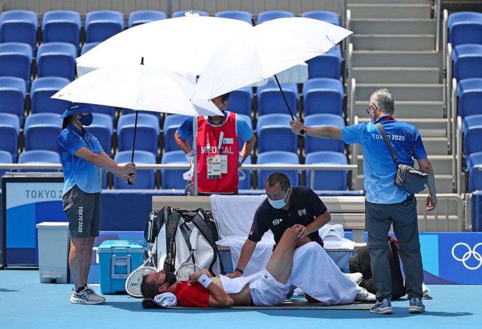 PHOTO: Daniil Medvedev of ROC (Russian Olympic Committee) gets medical treatment during men's singles third round against Fabio Fognini of Italy at Ariake Tennis Park in Tokyo on July 28, 2021.