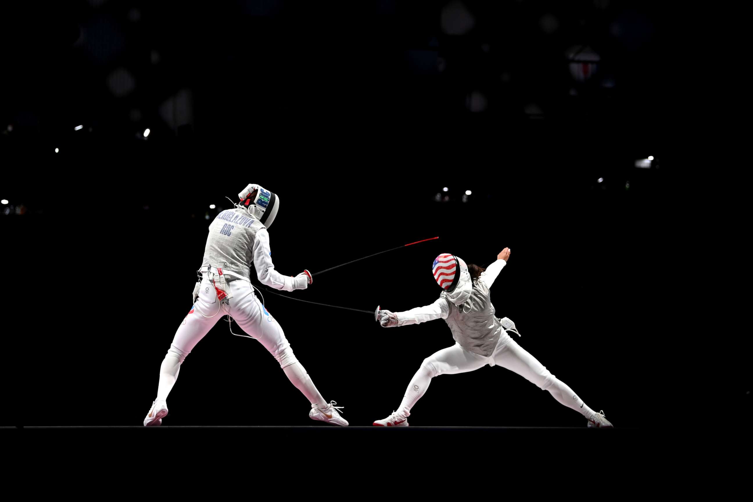 PHOTO: Inna Deriglazova of Team ROC, left, competes against Lee Kiefer of Team United States in the Women's Foil Individual Fencing Gold Medal Bout on day two of the Tokyo 2020 Olympic Games on July 25, 2021 in Chiba, Japan. 