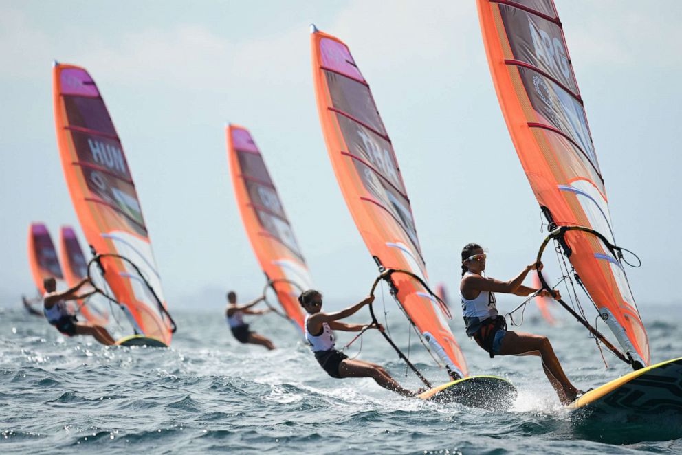 PHOTO: Competitors take part in the women's windsurfer race during the Tokyo 2020 Olympic Games sailing competition at the Enoshima Yacht Harbour in Fujisawa, Kanagawa Prefecture, Japan, on July 29, 2021.