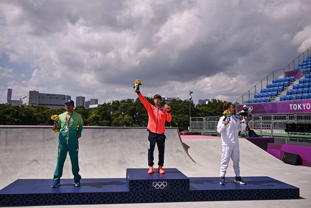 PHOTO: Gold medallist Japan's Yuto Horigome, silver medallist Brazil's Kelvin Hoefler and bronze medallist Jagger Eaton of the U.S. pose on the podium at the end of the men's street during the Tokyo 2020 Olympic Games.