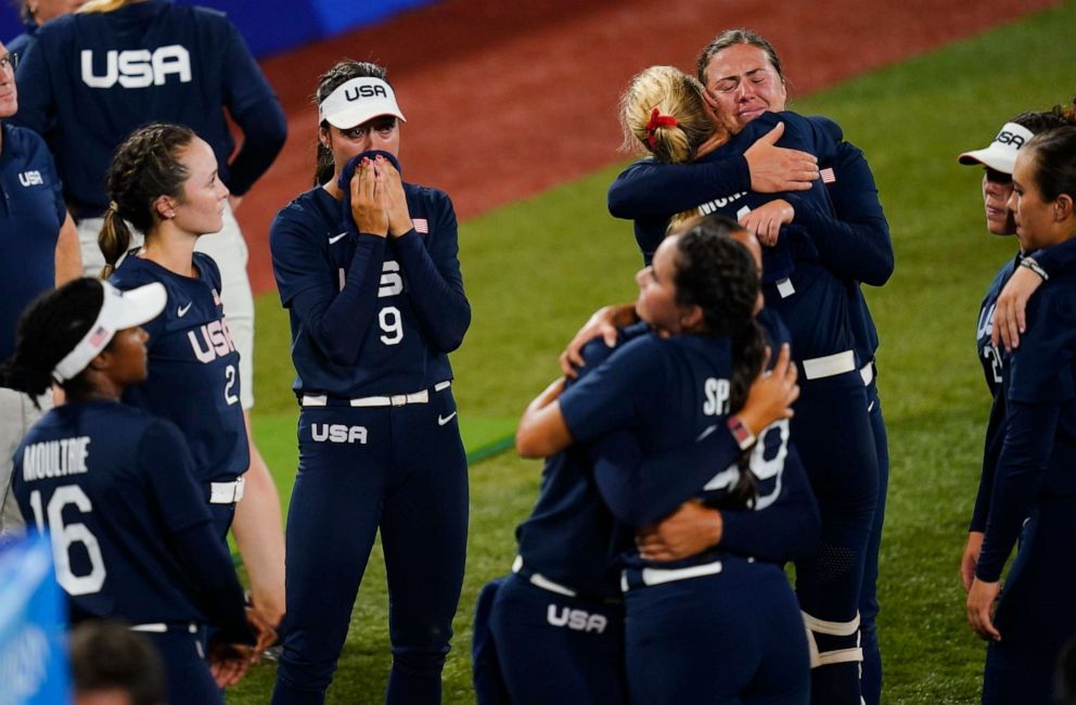 PHOTO: Members of team United States react after a softball game against Japan at the 2020 Summer Olympics, Tuesday, July 27, 2021, in Yokohama, Japan. Japan won 2-0.