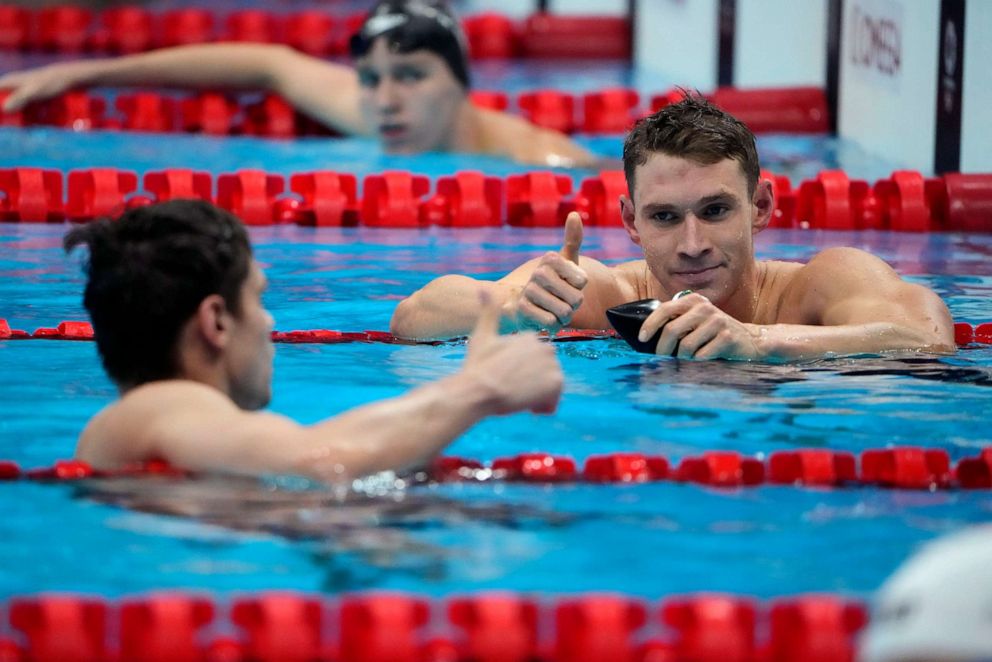 PHOTO: The United States' Ryan Murphy gives a thumbs up to Evgeny Rylov, of Russian Olympic Committee, after Rylov won the men's 200-meter backstroke final at the 2020 Summer Olympics, Friday, July 30, 2021, in Tokyo, Japan.