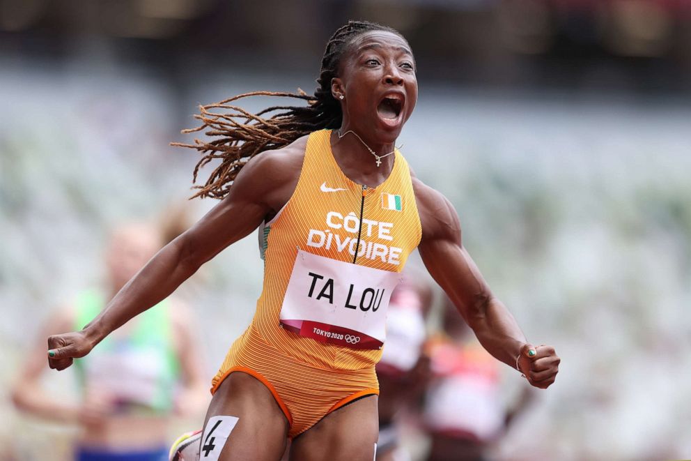 PHOTO: Marie-Josee Ta Lou of Team Ivory Coast reacts while competing during round one of the Women's 100m heats on day seven of the Tokyo 2020 Olympic Games at Olympic Stadium on July 30, 2021 in Tokyo, Japan.