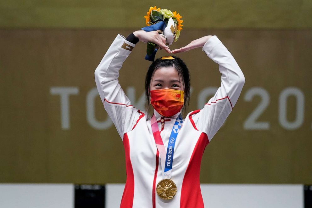 PHOTO: Qian Yang, of China, reacts after winning the gold medal in the women's 10-meter air rifle at the Asaka Shooting Range in the 2020 Summer Olympics, Saturday, July 24, 2021, in Tokyo, Japan.