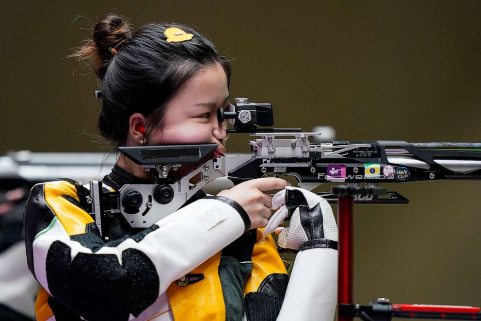 PHOTO: Qian Yang, of China, competes in the women's 10-meter air rifle at the Asaka Shooting Range in the 2020 Summer Olympics, Saturday, July 24, 2021, in Tokyo, Japan.