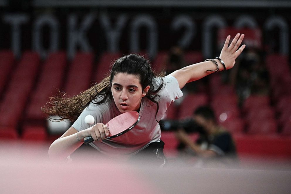 PHOTO: Syria's Hend Zaza hits a shot against Austria's Liu Jia during their women's singles preliminary round table tennis match at the Tokyo Metropolitan Gymnasium during the Tokyo 2020 Olympic Games in Tokyo on July 24, 2021.