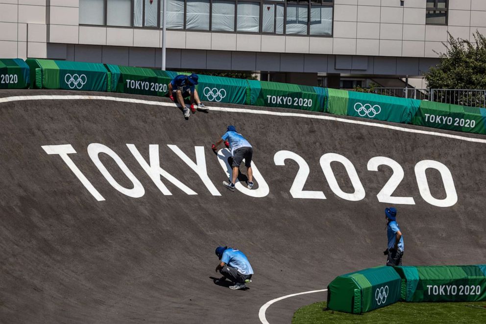 PHOTO: Staff work on the Olympic BMX racing track at Ariake Urban Sports Park in Tokyo, Japan, on July 22, 2021.