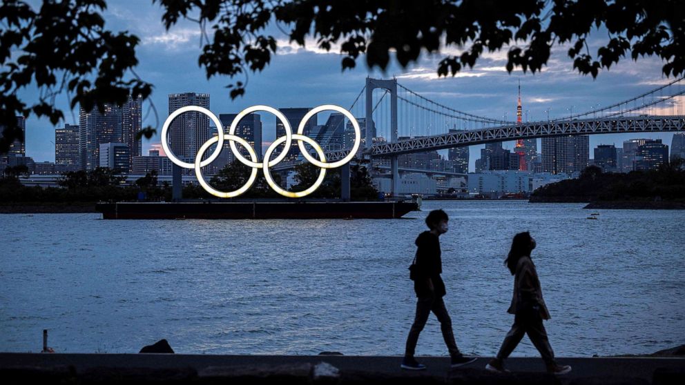 PHOTO: The Olympic rings lit up at dusk on the Odaiba waterfront in Tokyo on April 28, 2021.