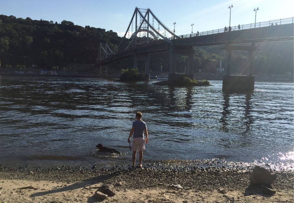 PHOTO: Tom walking his dog along the Dnipro river in Kyiv, Ukraine, in 2016.