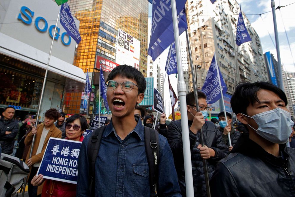 PHOTO: Pro-independence demonstrator Tony Chung, left, marches during an annual New Year protest in Hong Kong, Jan. 1, 2019.