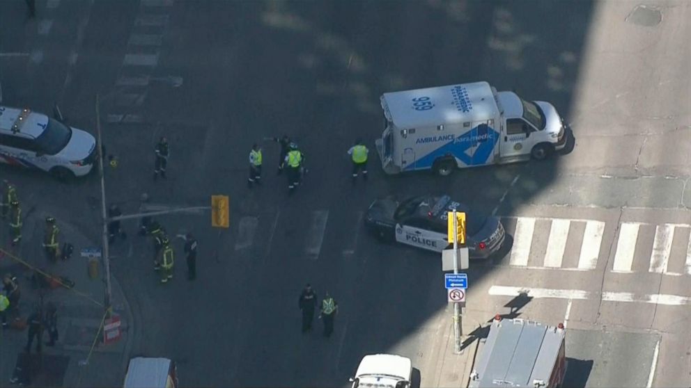 PHOTO: Police arrive on the scene where a white van struck pedestrians, April 23, 2018, in Toronto, Canada.