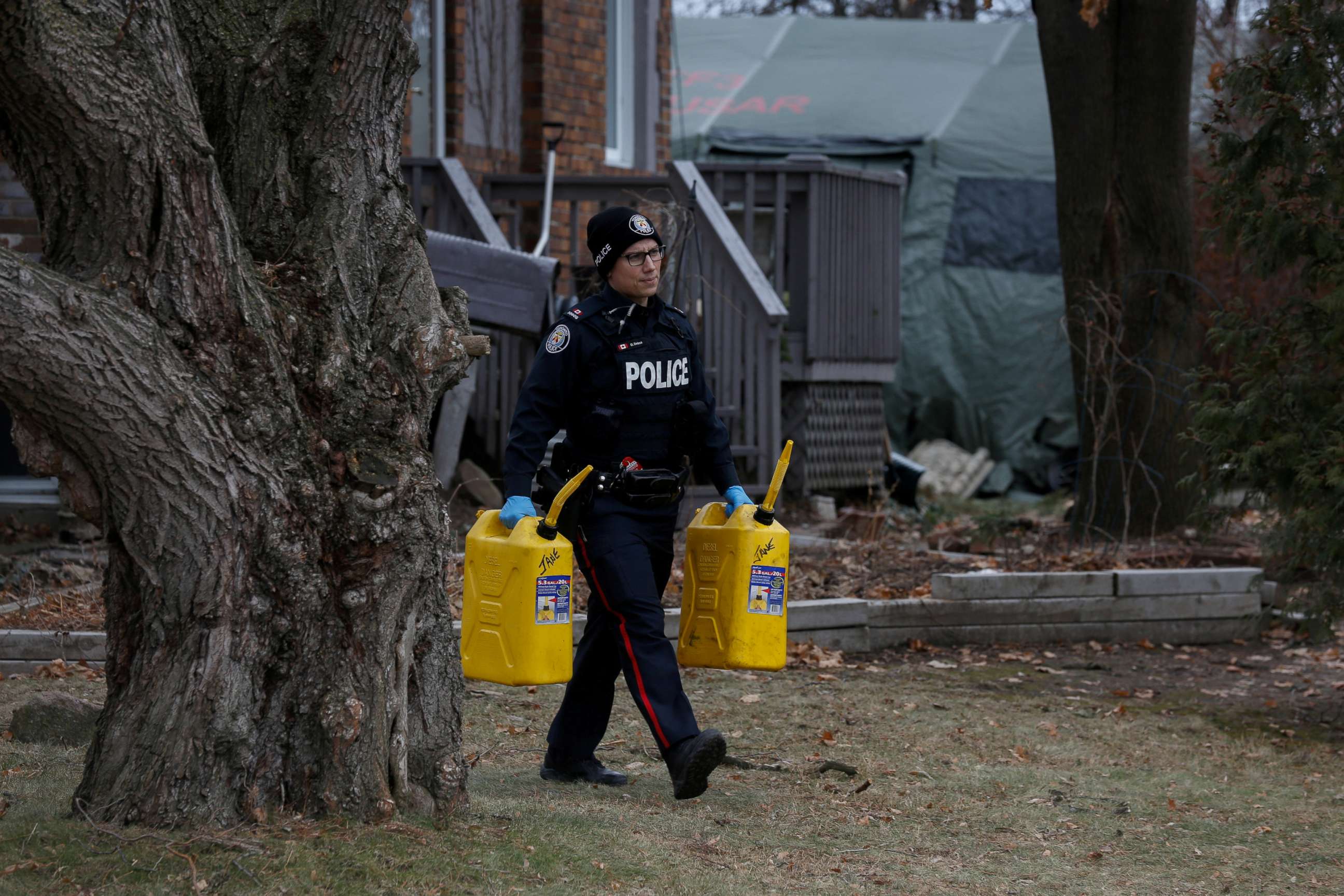 PHOTO: Police guard the grounds of a house they searched, after landscaper Bruce McArthur was accused of murdering five people in Toronto, Jan. 29, 2018.