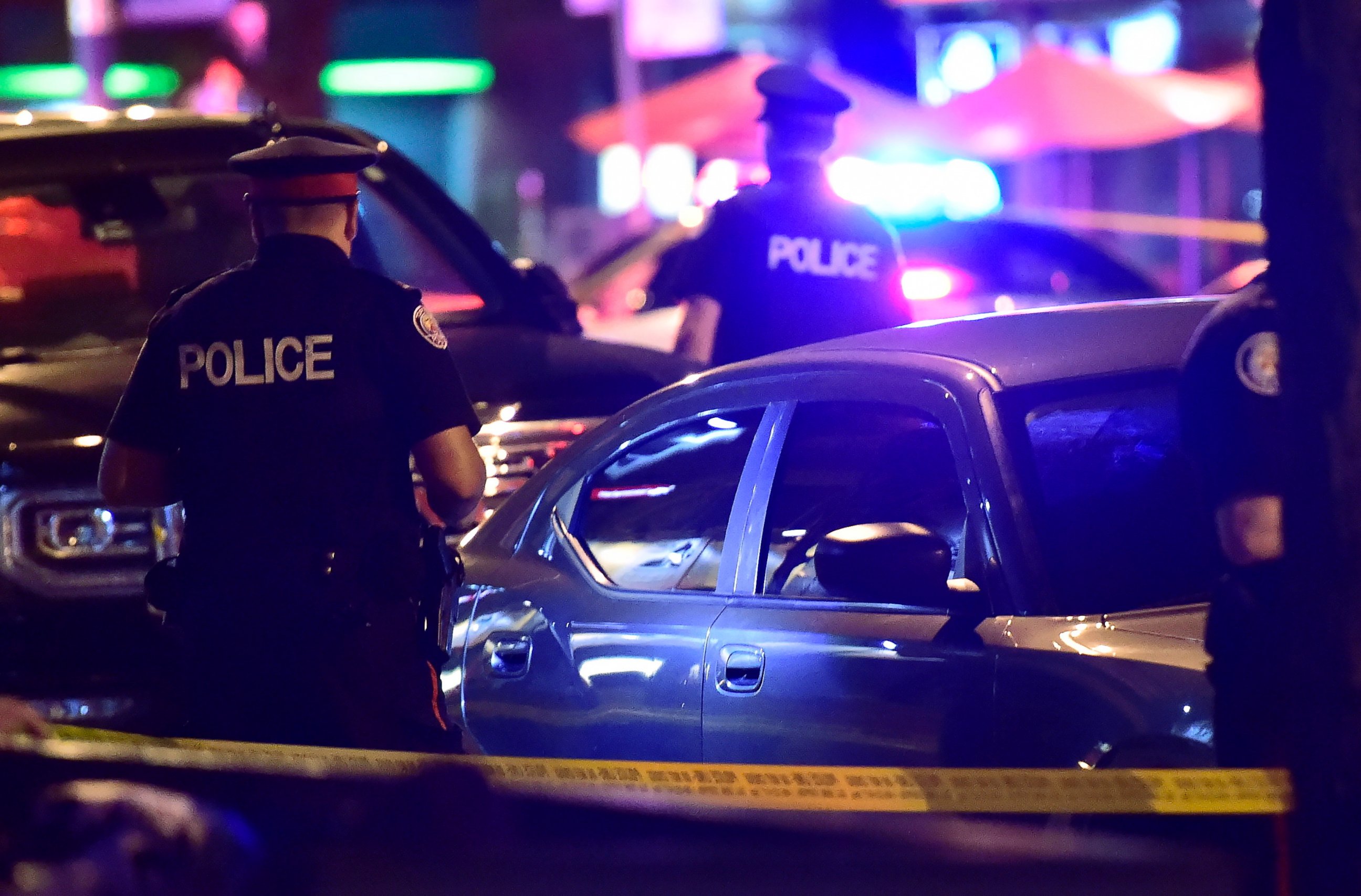Police work the scene of a shooting in Toronto on Sunday, July 22, 2018.