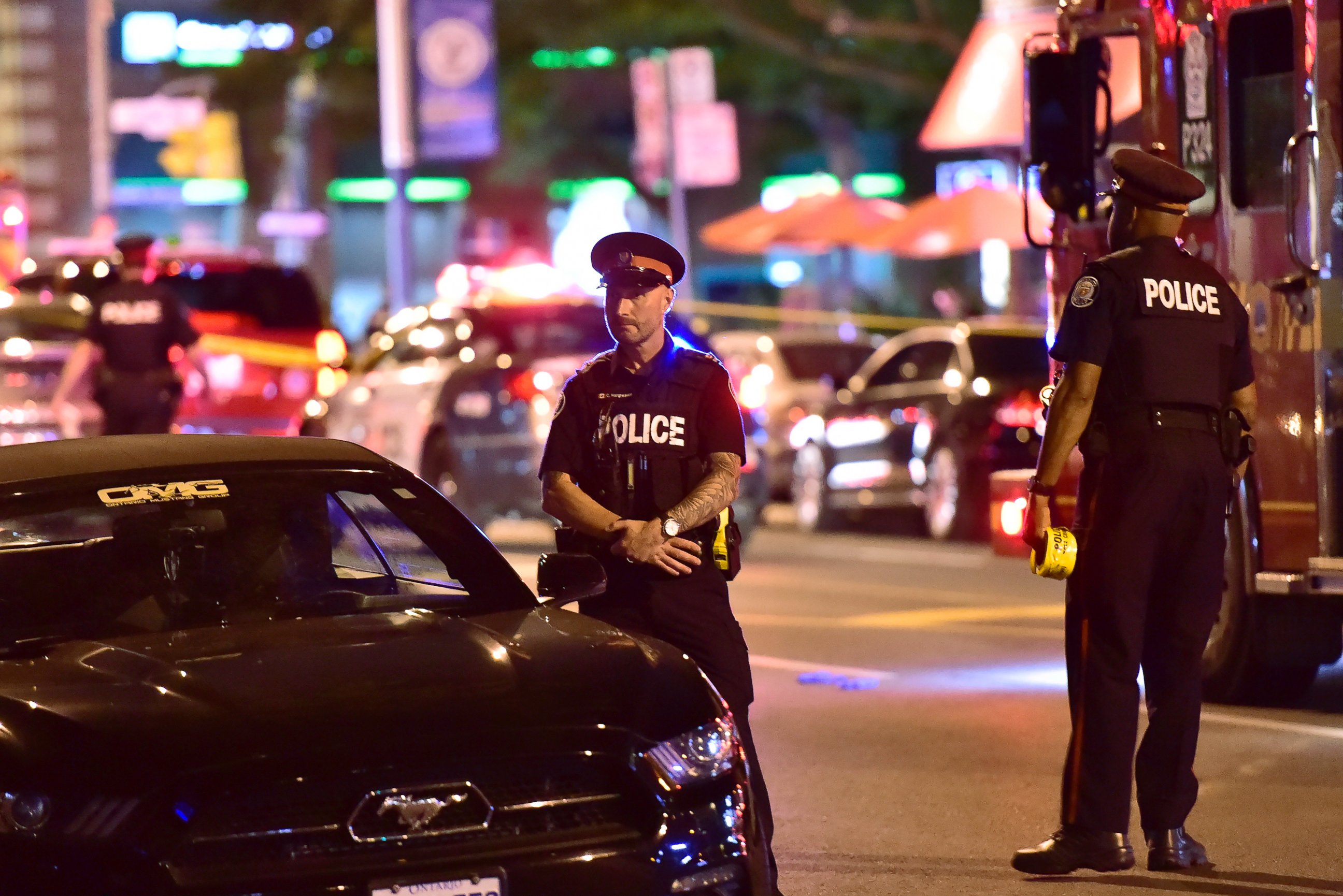 Police work the scene of a shooting in Toronto on Sunday, July 22, 2018.