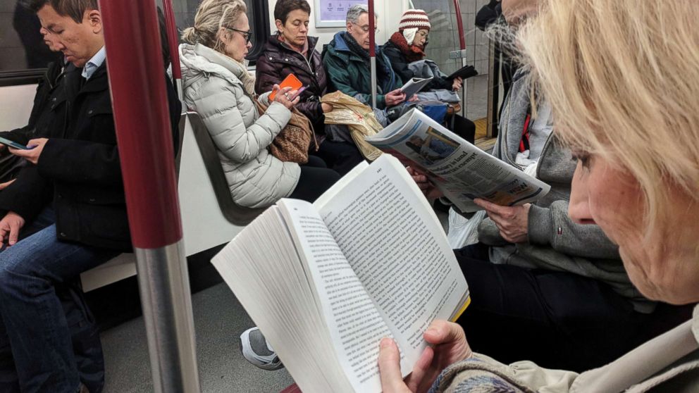PHOTO: Morning commuters read while riding the TTC Subway in Toronto, Ontario, Canada, Nov. 16, 2017.