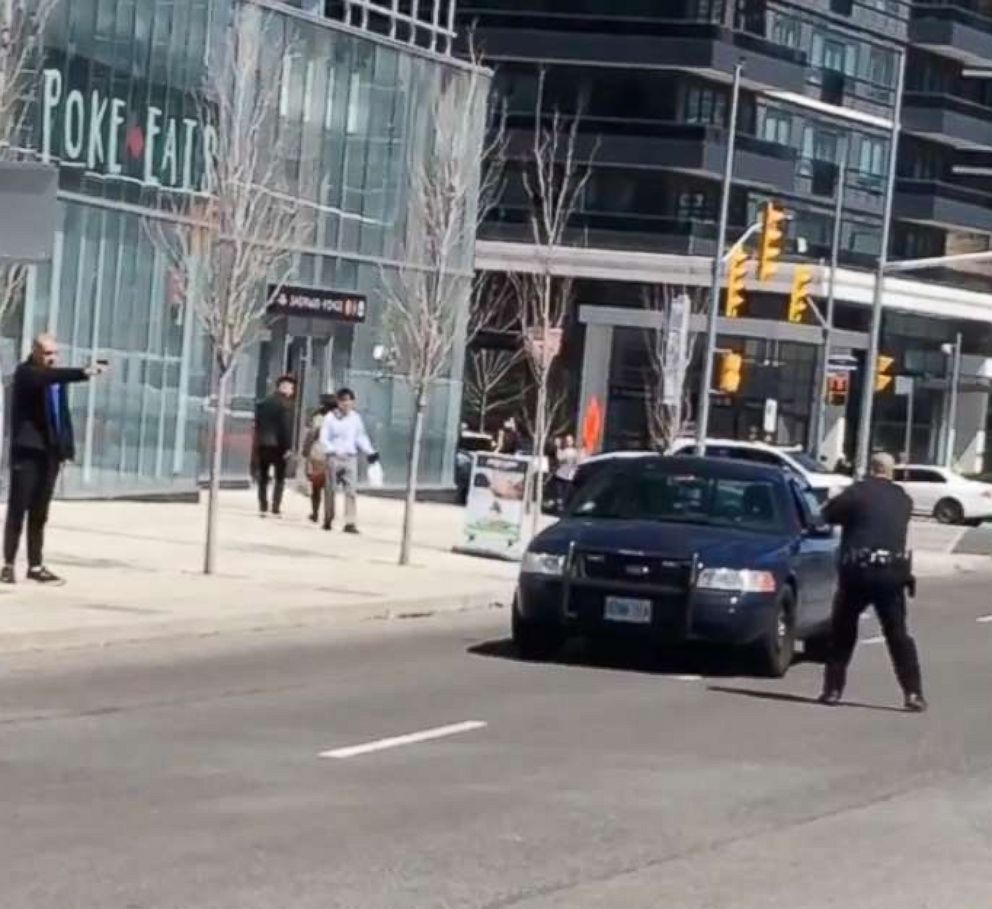 PHOTO: Video footage shows a police officer confronting the man who allegedly rammed into pedestrians with a van in Toronto, Canada, April 23, 2018.