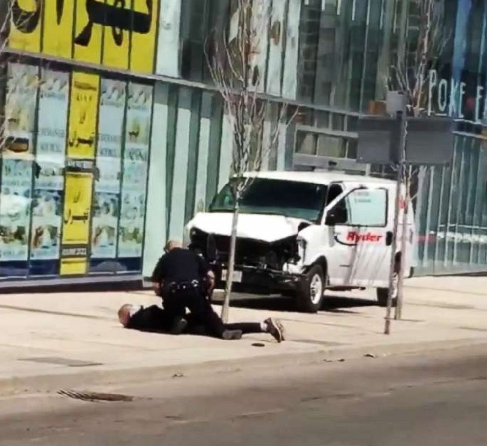 PHOTO: Video footage shows a police officer confronting the man who allegedly rammed into pedestrians with a van in Toronto, Canada, April 23, 2018.