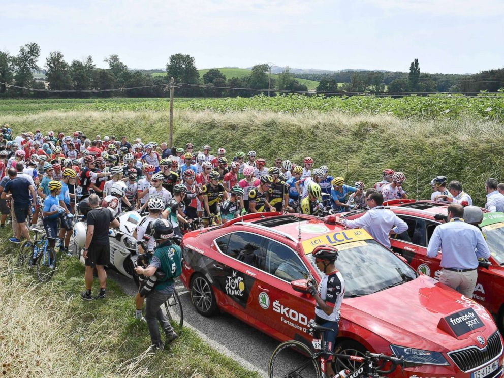   PHOTO: The peloton is waiting for the resumption of the stage, after the use of tear gas during a demonstration of farmers, during the cycling race of the Tour de France, between Carcassonne and Bagneres. - Luchon, July 24, 2018 