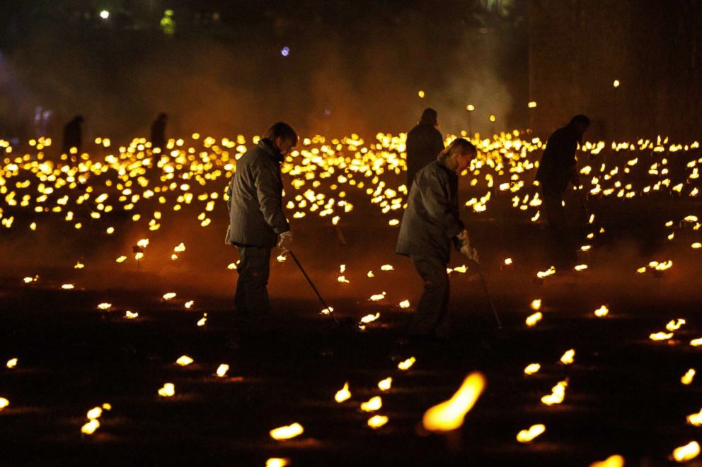 PHOTO: People light thousands of flames in a lighting ceremony at the Tower of London, Nov. 4, 2018, as part of an installation called "Beyond the Deepening Shadow: The Tower Remembers," marking the end of the First World War.