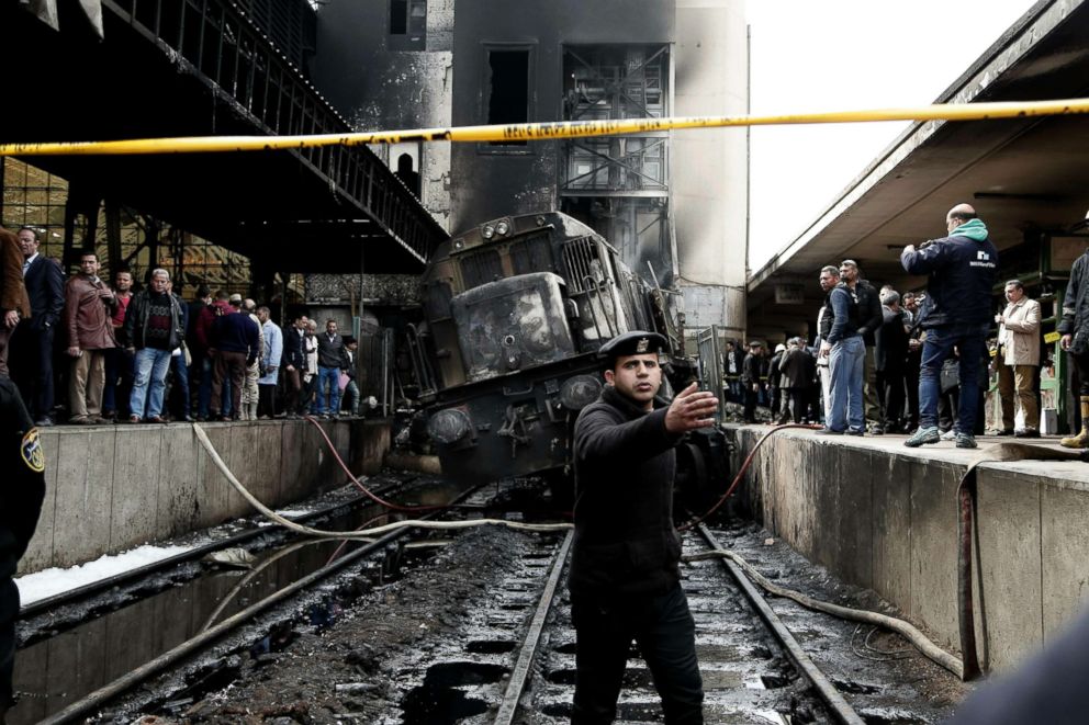 PHOTO: Policemen stand guard in front of a damaged train inside Ramsis train station in Cairo, Egypt,  Feb. 27, 2019.