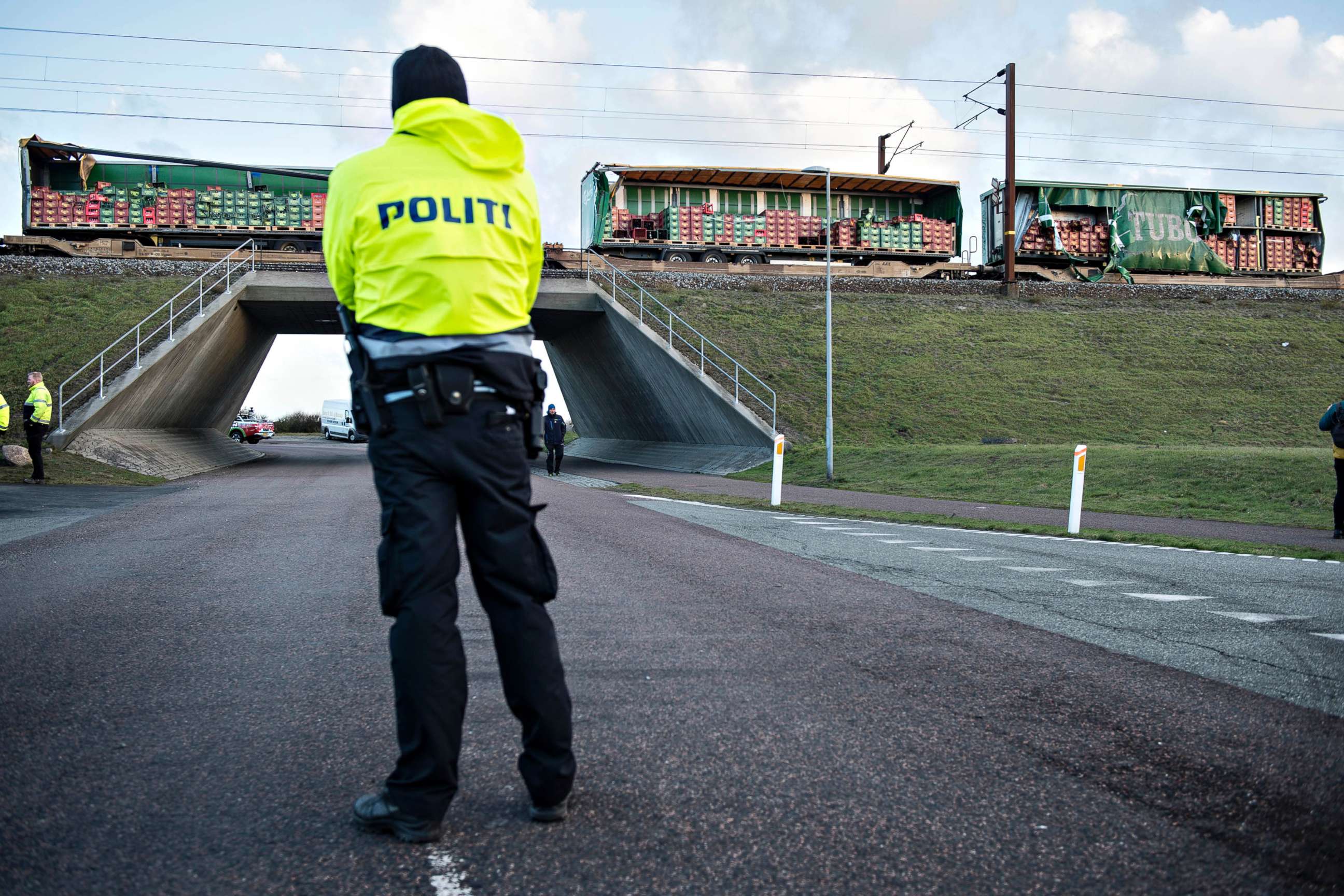 PHOTO: A police officer looks on near a damaged cargo train compartment near the Storebaelt bridge, near Nyborg in Denmark, Jan. 2, 2019. 