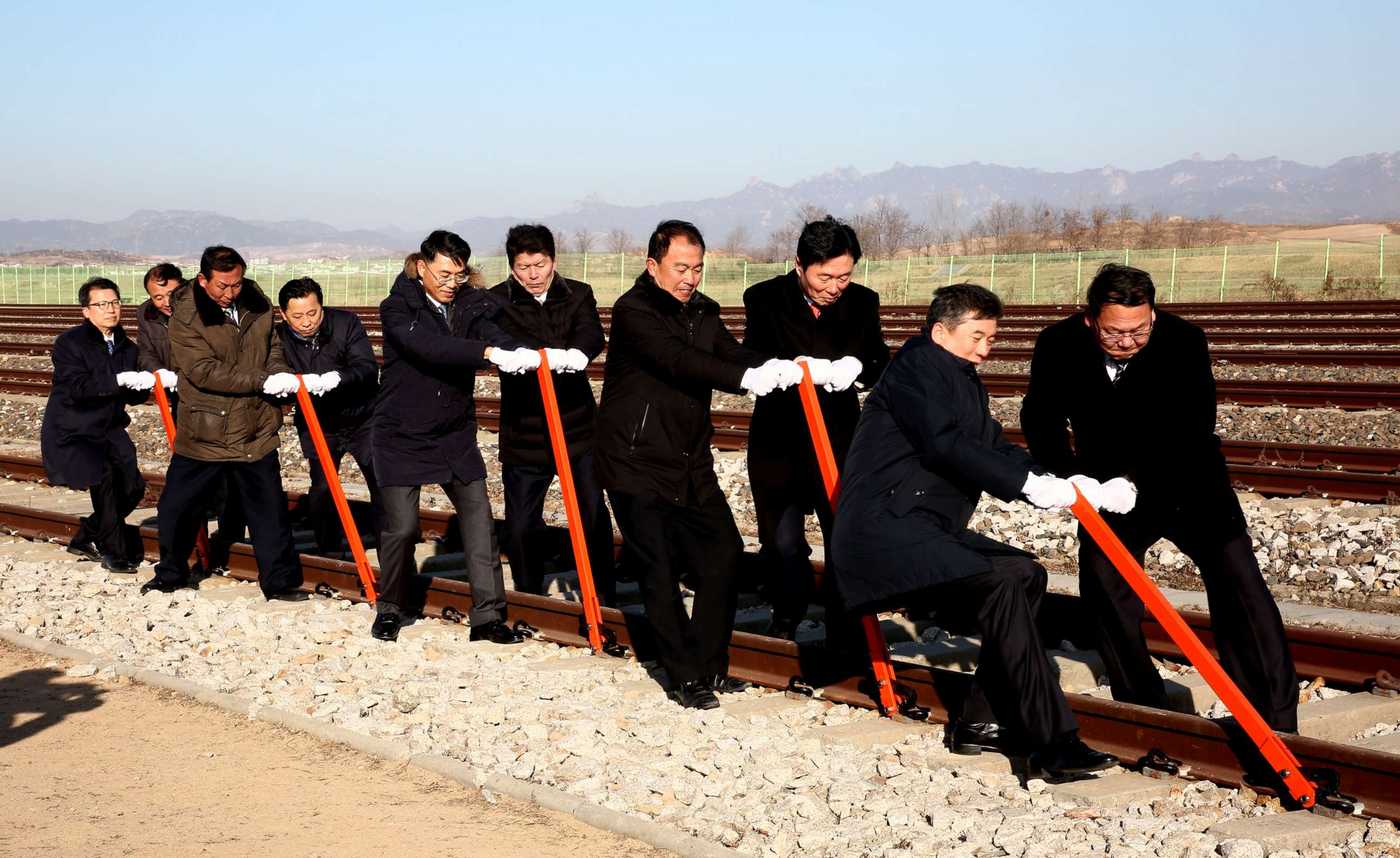 PHOTO:South and North Korea's officials try to connect the railroad during the ceremony for a project to modernize and connect roads and railways over the border between the Koreas at Panmun Station, Dec. 26, 2018, in Kaesong, North Korea.
