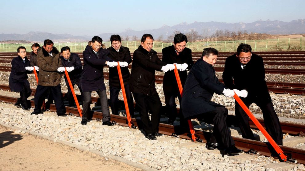 PHOTO:South and North Korea's officials try to connect the railroad during the ceremony for a project to modernize and connect roads and railways over the border between the Koreas at Panmun Station, Dec. 26, 2018, in Kaesong, North Korea.