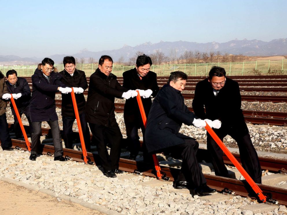 PHOTO:South and North Koreas officials try to connect the railroad during the ceremony for a project to modernize and connect roads and railways over the border between the Koreas at Panmun Station, Dec. 26, 2018, in Kaesong, North Korea.