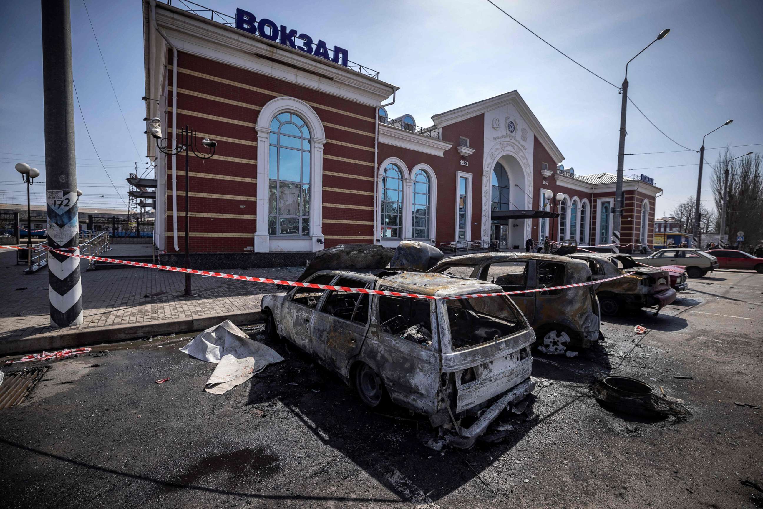 PHOTO: Burnt cars are left outside a train station in Kramatorsk, eastern Ukraine, where civilians had gathered to evacuate, after it was hit by a rocket, killing scores, April 8, 2022.