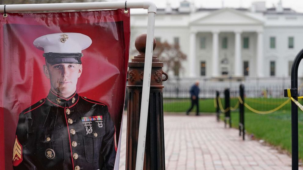 PHOTO: A poster photo of U.S. Marine Corps veteran and Russian prisoner Trevor Reed stands in Lafayette Park near the White House, March 30, 2022, in Washington. D.C.