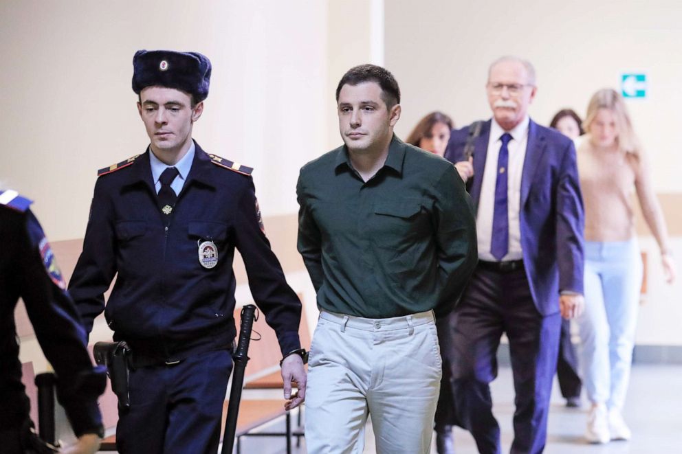 PHOTO: U.S. ex-Marine Trevor Reed, who was detained in 2019 and accused of assaulting police officers, is escorted before a court hearing in Moscow, March 11, 2020. 